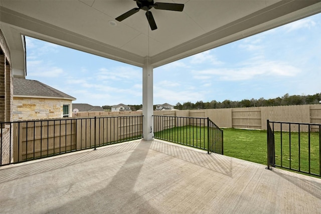 view of patio / terrace with a balcony and ceiling fan