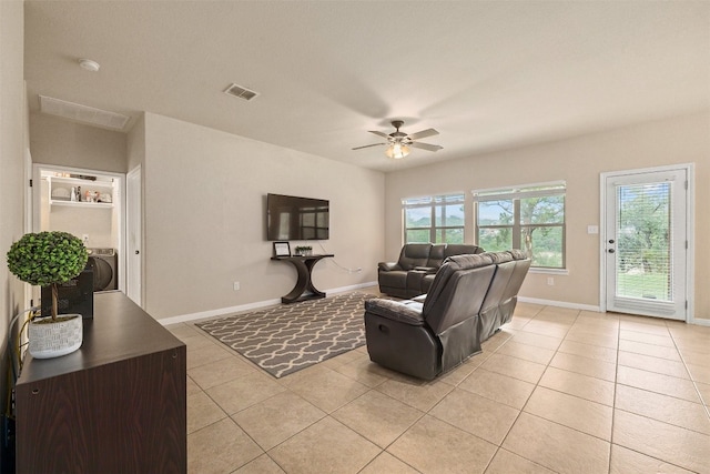 living room featuring ceiling fan and light tile patterned floors