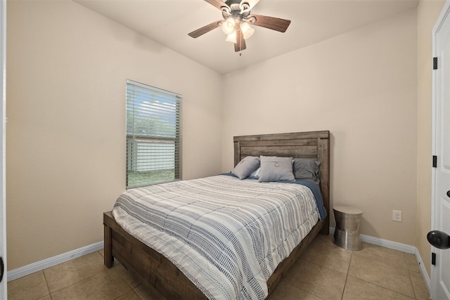 bedroom with light tile patterned floors and ceiling fan