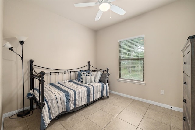 bedroom featuring ceiling fan and light tile patterned floors