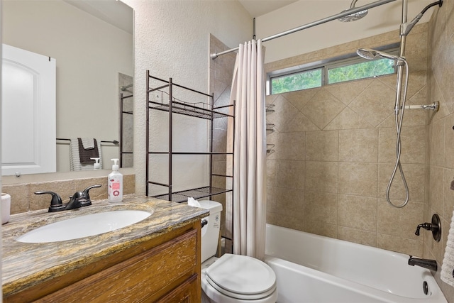 full bathroom featuring toilet, shower / tub combo with curtain, and vanity