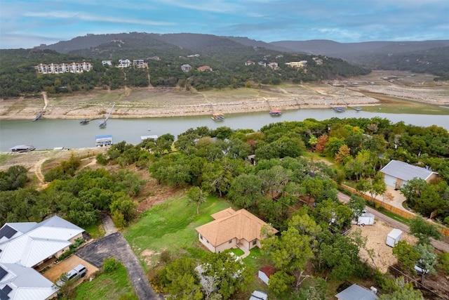 drone / aerial view with a water and mountain view