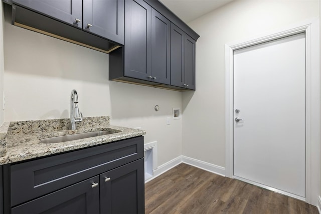 laundry room featuring cabinets, dark wood-type flooring, sink, and hookup for a washing machine