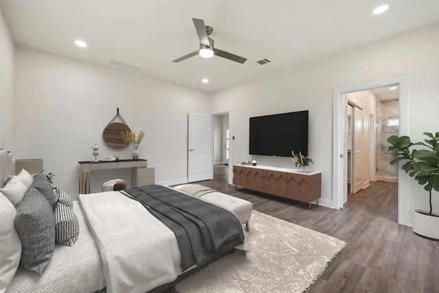 bedroom featuring dark hardwood / wood-style floors, ceiling fan, and radiator heating unit