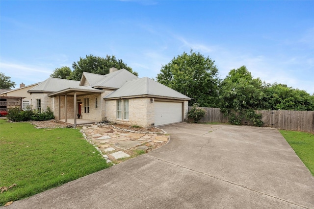 ranch-style house featuring a front lawn, covered porch, and a garage