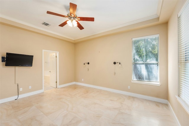 spare room with ceiling fan and ornamental molding