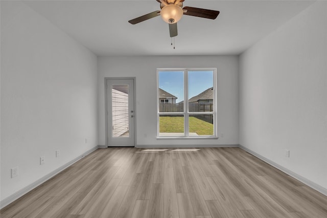 spare room featuring light hardwood / wood-style floors and ceiling fan