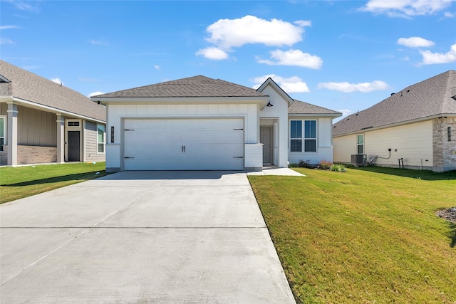 ranch-style house featuring central AC, a front lawn, and a garage