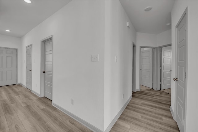 corridor featuring light hardwood / wood-style floors