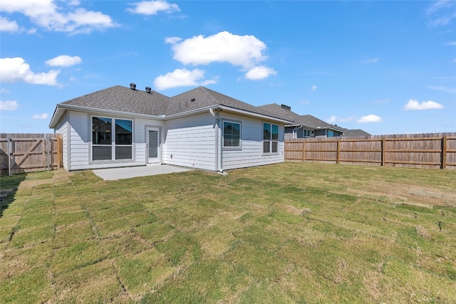 back of property featuring a patio and a yard