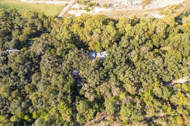 drone / aerial view with a view of trees