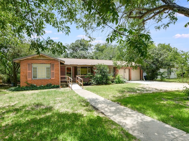 single story home with a front yard and a garage