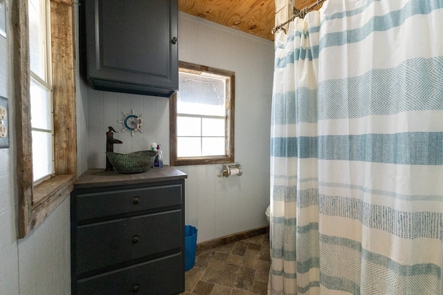 bathroom featuring tile floors and vanity with extensive cabinet space