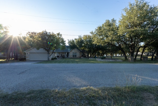 exterior space featuring a front lawn and a garage