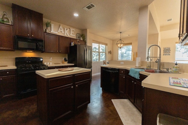 kitchen featuring sink, pendant lighting, black appliances, a notable chandelier, and dark brown cabinetry