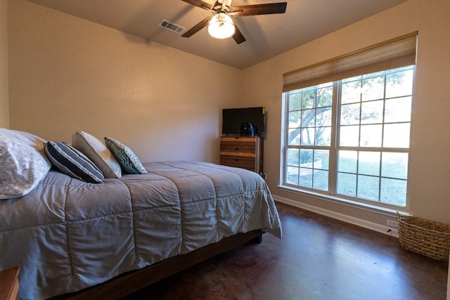 bedroom with multiple windows and ceiling fan