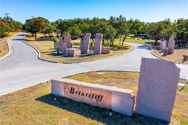 view of home's community with a lawn