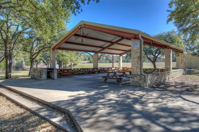 view of property's community with a gazebo and a patio