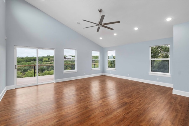 spare room with high vaulted ceiling, dark hardwood / wood-style flooring, and ceiling fan