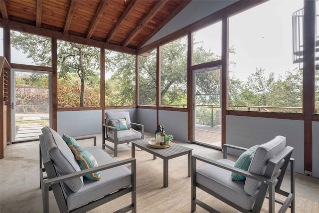 sunroom / solarium with lofted ceiling with beams and wood ceiling