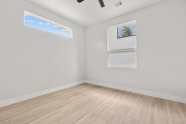 unfurnished room with light hardwood / wood-style flooring and ceiling fan