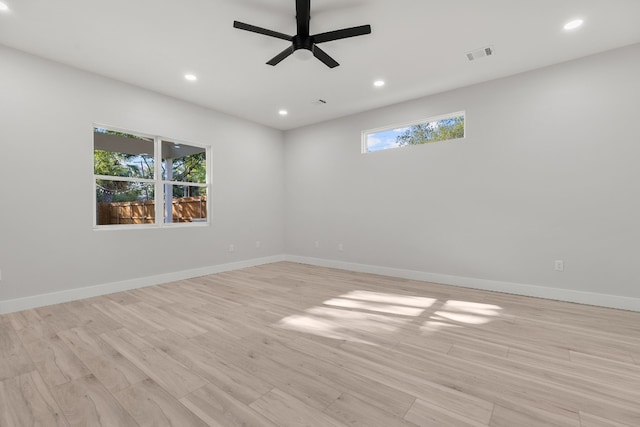 spare room with ceiling fan and light hardwood / wood-style flooring