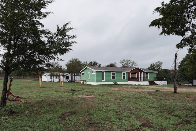 view of front of home with a front yard