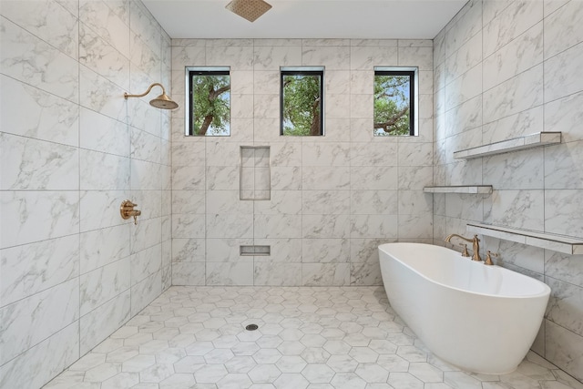 bathroom with tile walls, tile flooring, and separate shower and tub