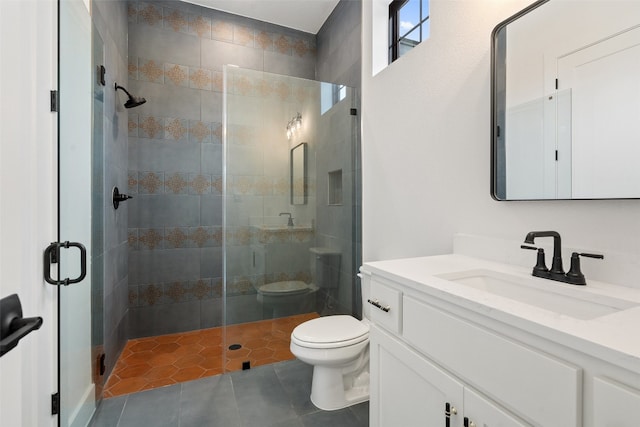 bathroom featuring tile floors, vanity, an enclosed shower, and toilet