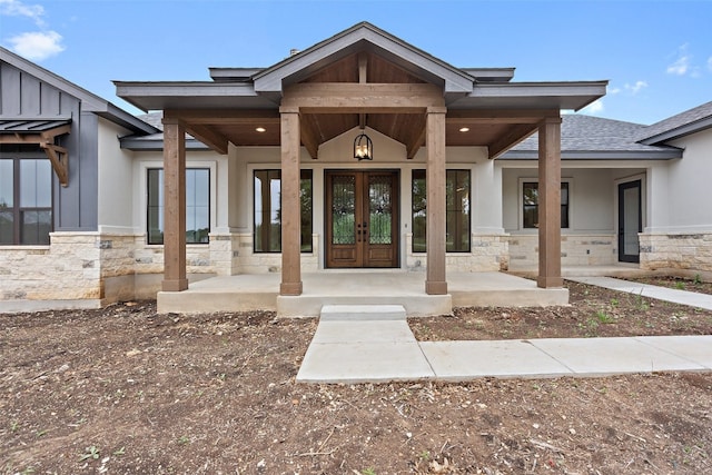 view of exterior entry with covered porch