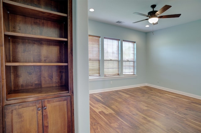 interior space with ceiling fan and wood-type flooring