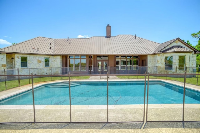 view of swimming pool featuring a fenced in pool and fence