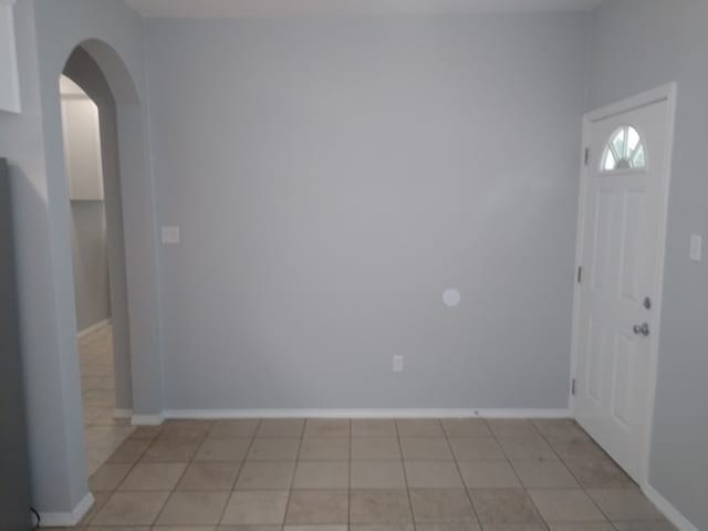 foyer entrance featuring light tile floors