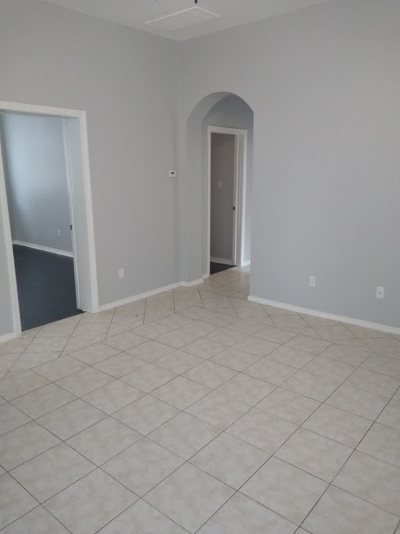 spare room featuring light tile floors