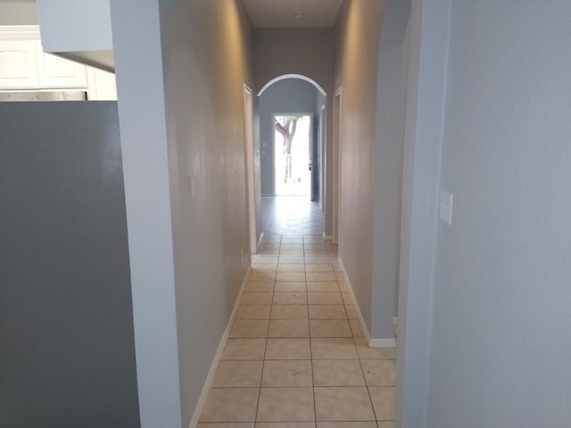 hallway featuring light tile floors