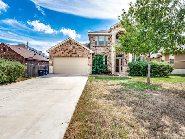 view of front of home with a garage and a front yard