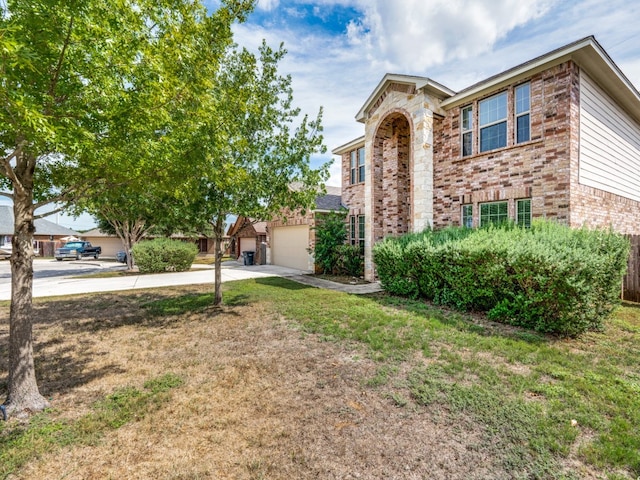 view of front facade featuring a front yard and a garage