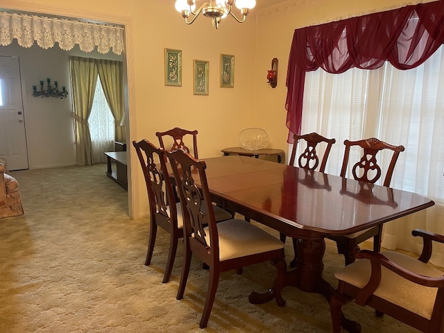 carpeted dining area with a notable chandelier