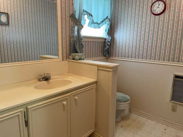 bathroom with vanity, tile floors, and toilet