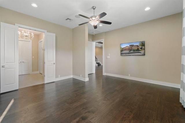 empty room featuring dark wood-type flooring, recessed lighting, visible vents, and baseboards