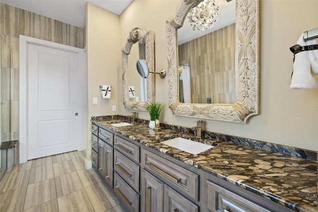 full bathroom with double vanity and a sink