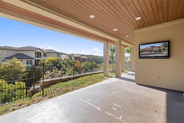 view of patio / terrace featuring a residential view and fence