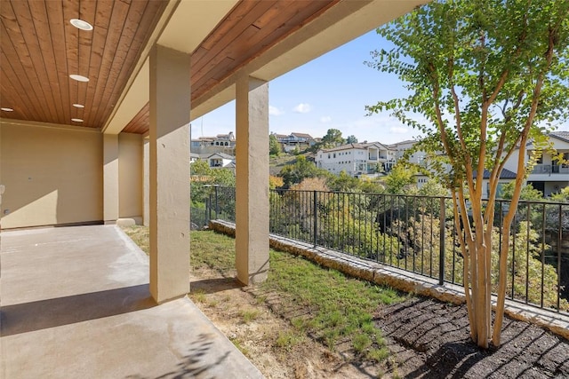 view of yard with a patio area, a residential view, and fence