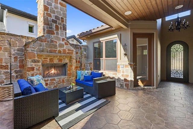 view of patio featuring an outdoor living space with a fireplace