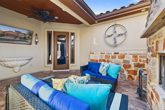 view of patio / terrace featuring ceiling fan and an outdoor living space