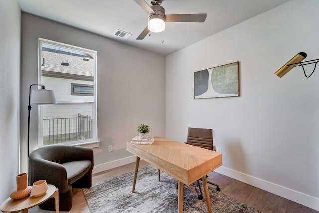 office space featuring ceiling fan and hardwood / wood-style floors