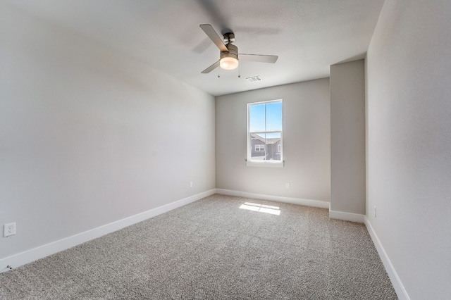 carpeted empty room with ceiling fan