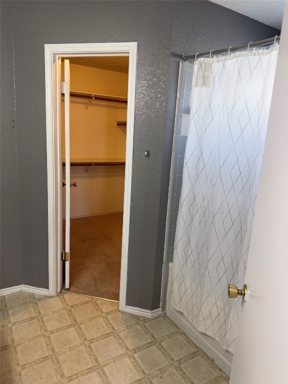 bathroom featuring tile flooring