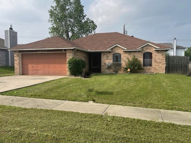 ranch-style house with a garage and a front yard