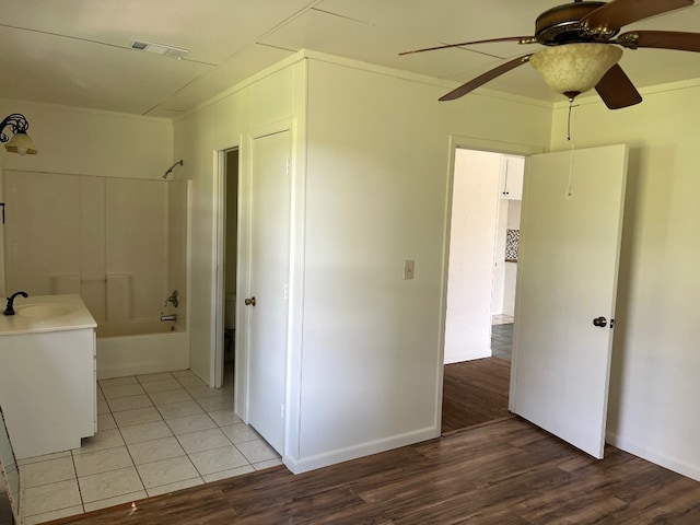 bathroom featuring tile flooring, shower / bath combination, ceiling fan, and vanity